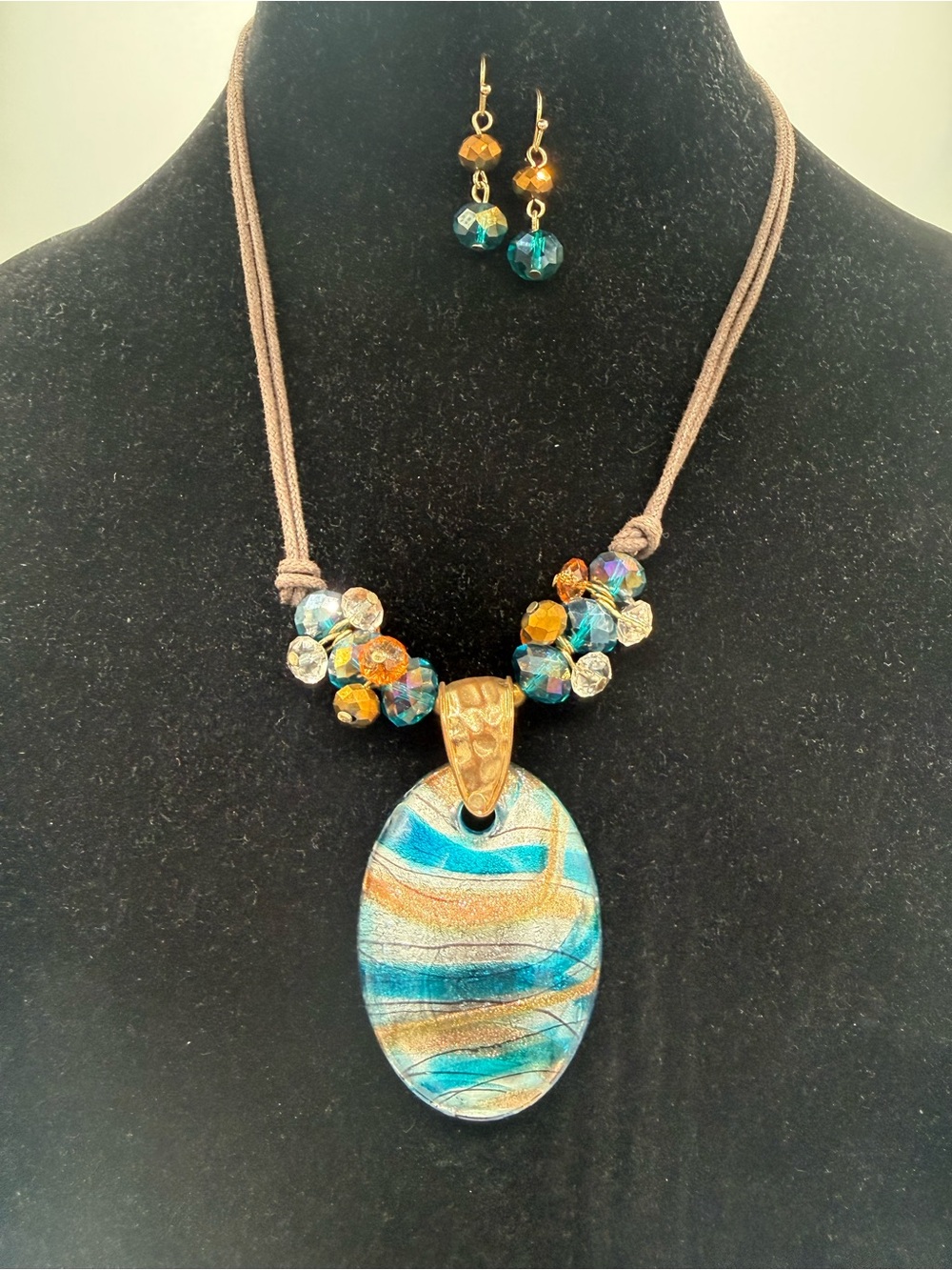 Blue and Gold Swirl Pendant Necklace with Faceted Bead Accents